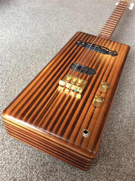 metal or nylon for electrified cigar box guitar|cigar box guitar conversion.